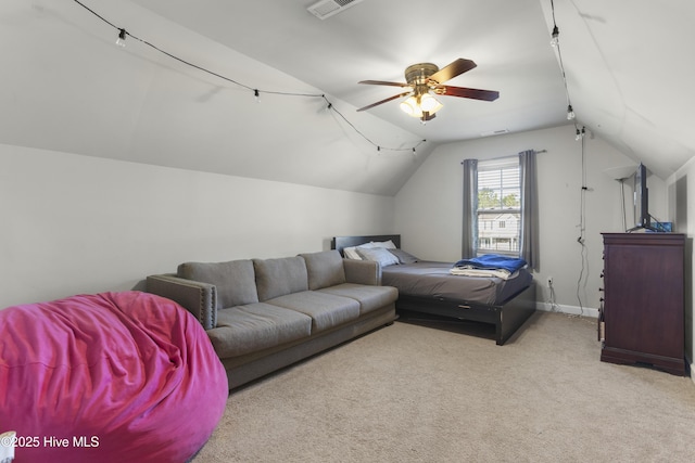 carpeted bedroom featuring ceiling fan and vaulted ceiling