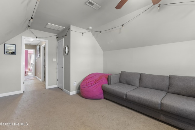 carpeted living room featuring ceiling fan, track lighting, and vaulted ceiling