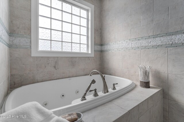 bathroom with tile walls, vanity, ceiling fan, toilet, and a shower with shower curtain