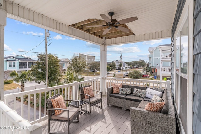 deck featuring an outdoor hangout area and ceiling fan