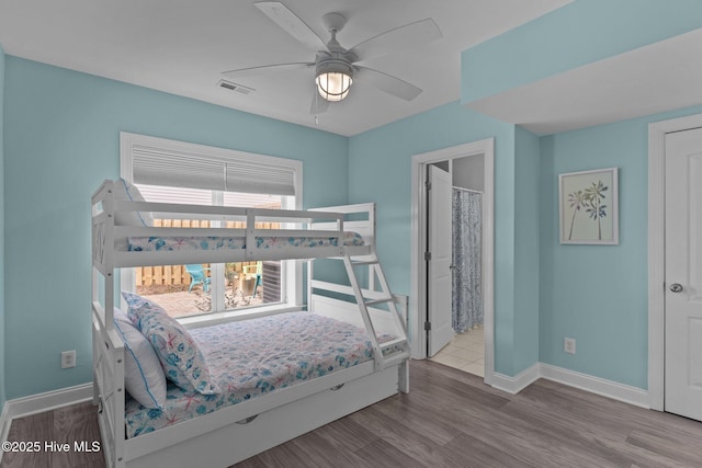 bedroom with wood-type flooring and ceiling fan