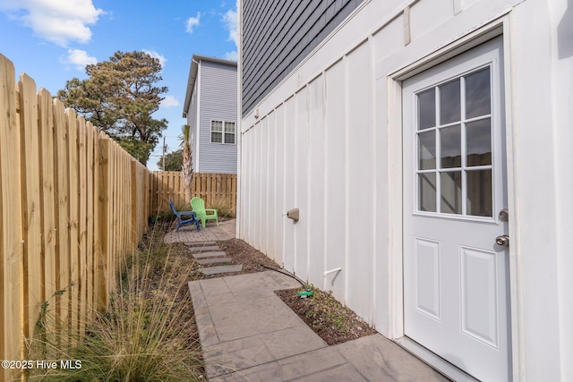 view of side of property with a patio area