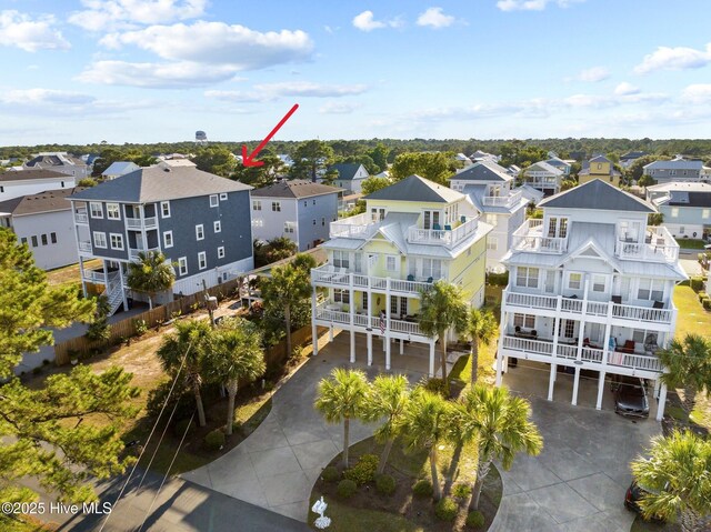 raised beach house featuring ceiling fan, a garage, and a porch