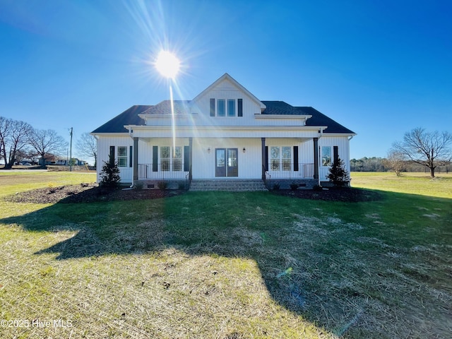 view of front of house featuring a front lawn and covered porch