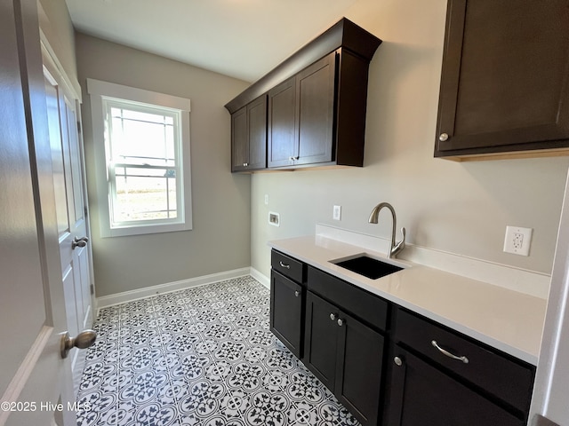 kitchen with dark brown cabinetry and sink