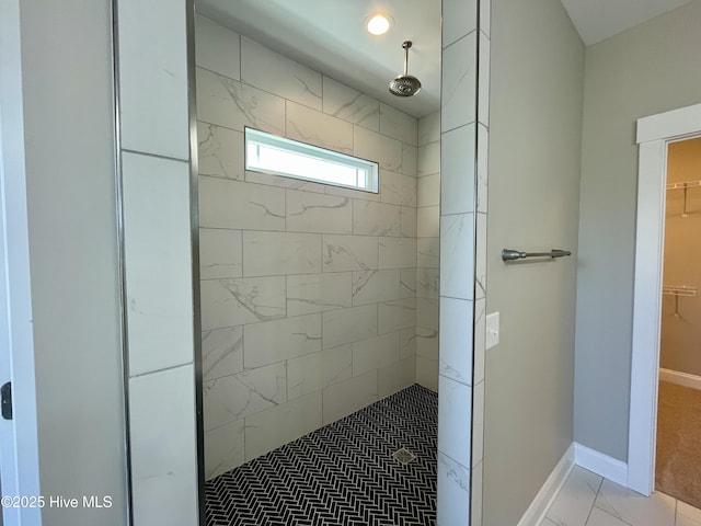 bathroom with tiled shower