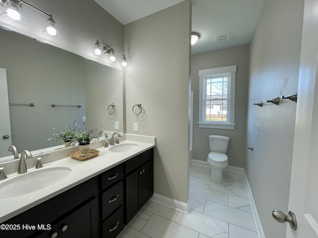 bathroom with vanity and toilet