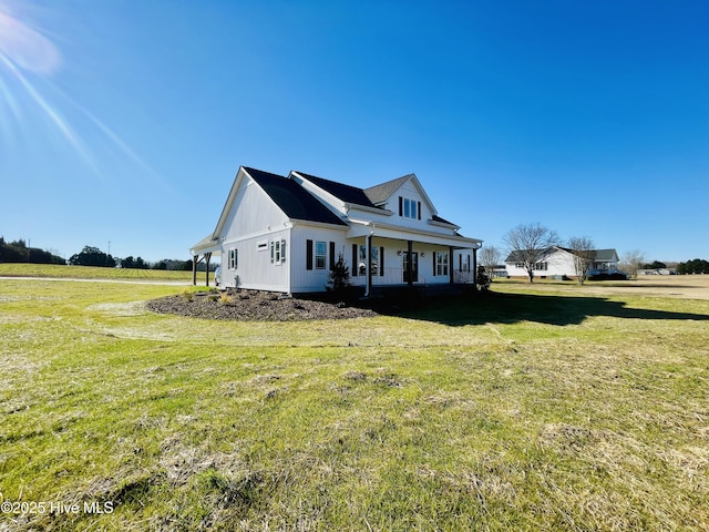 view of front of house featuring a porch and a front yard