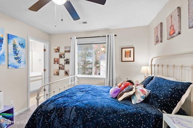 bedroom with ceiling fan and light carpet