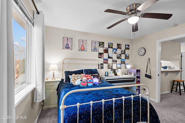 bedroom featuring carpet, multiple windows, and ceiling fan