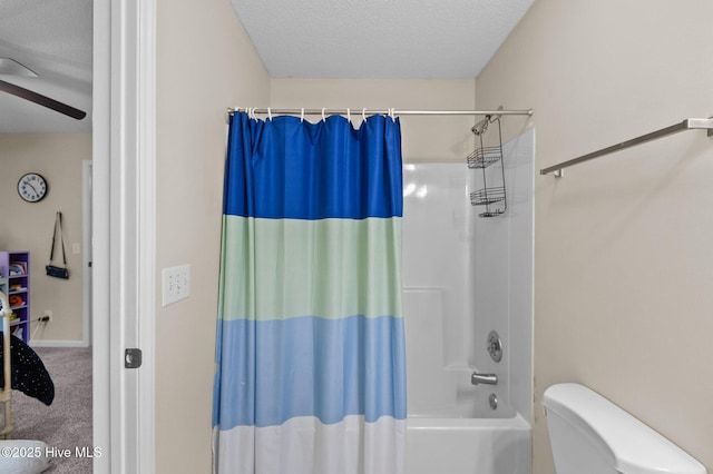 bathroom featuring a textured ceiling, toilet, ceiling fan, and shower / bath combo with shower curtain