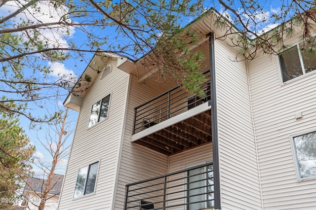 view of home's exterior with a balcony