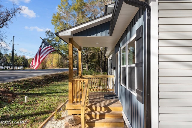 wooden deck featuring a yard