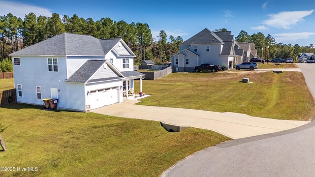 back of house featuring a lawn and a patio area