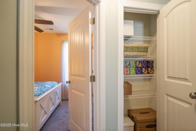 carpeted bedroom featuring ceiling fan