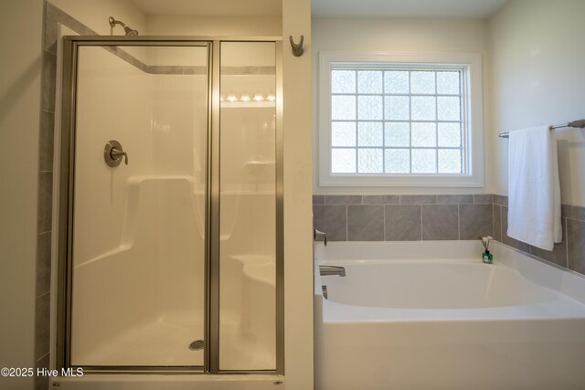 bathroom with separate shower and tub, tile patterned flooring, and vanity