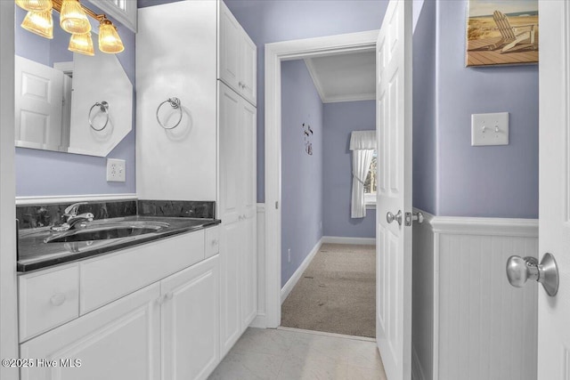 bathroom featuring vanity and crown molding