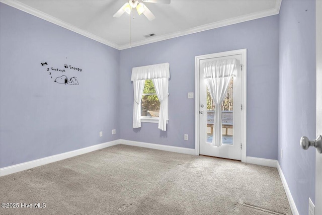 carpeted empty room with ceiling fan and ornamental molding