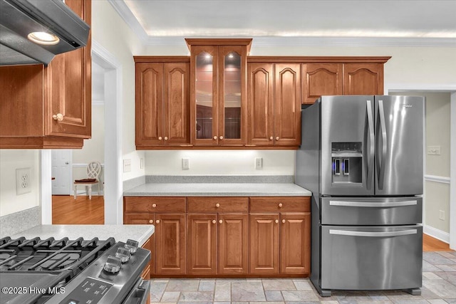 kitchen with stainless steel appliances and crown molding