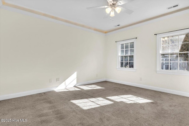 carpeted empty room with crown molding and ceiling fan