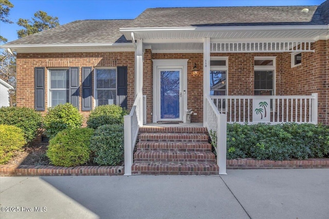 doorway to property with covered porch