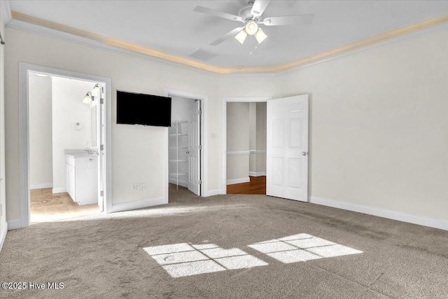 unfurnished bedroom featuring carpet, connected bathroom, and ceiling fan