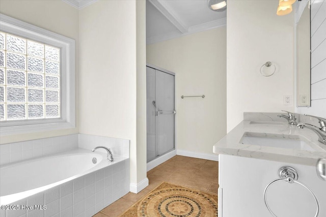 bathroom with vanity, tile patterned floors, ornamental molding, and tiled tub