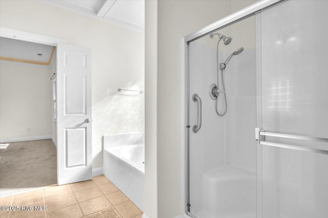 bathroom featuring tile patterned floors, independent shower and bath, and ornamental molding