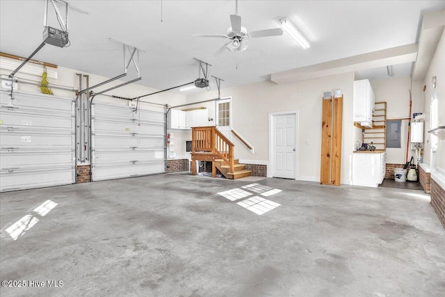 garage featuring ceiling fan and a garage door opener