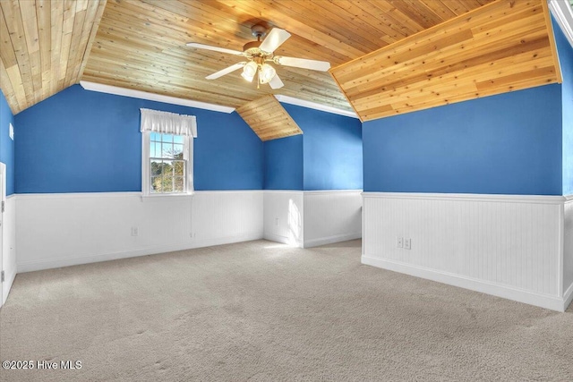 additional living space with carpet flooring, vaulted ceiling, and wooden ceiling