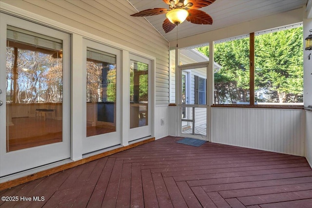 unfurnished sunroom with ceiling fan and lofted ceiling