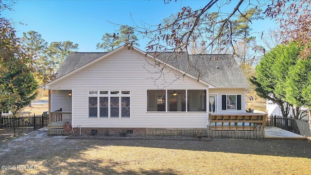 back of house featuring a patio and a sunroom