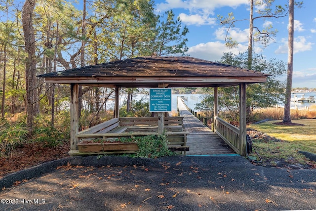 exterior space featuring a gazebo and a water view