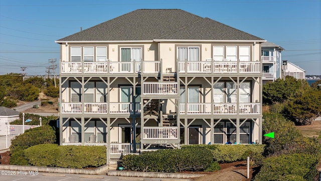 back of house with a balcony