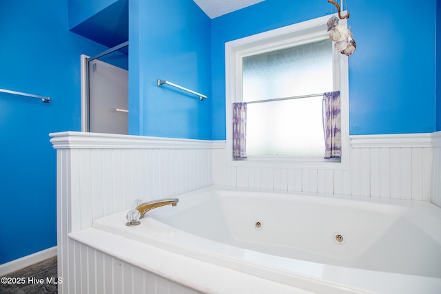 bathroom featuring a bathing tub and a textured ceiling