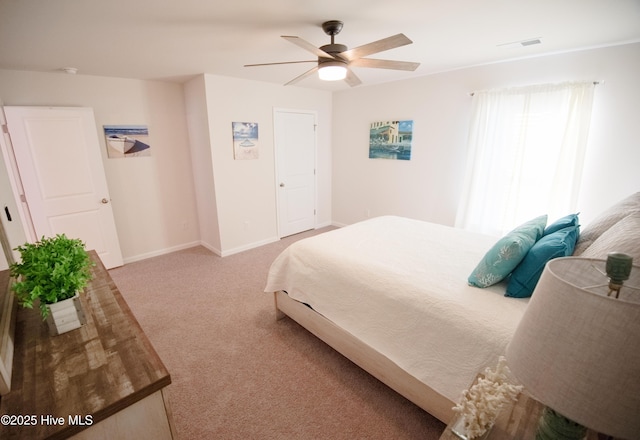 bedroom featuring ceiling fan and light carpet