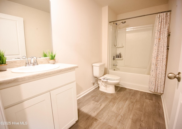 full bathroom with hardwood / wood-style floors, vanity, shower / bath combo, and toilet