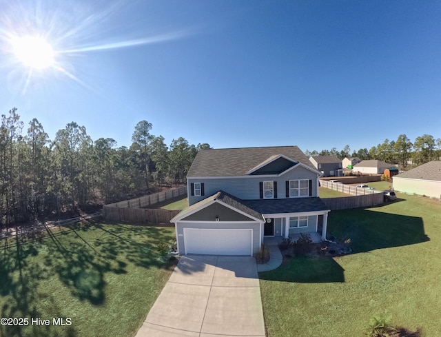 front of property with a front lawn and a garage