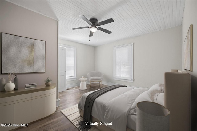 bedroom with ceiling fan, dark hardwood / wood-style flooring, and wood ceiling