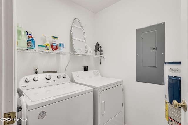 washroom with washer and clothes dryer and electric panel