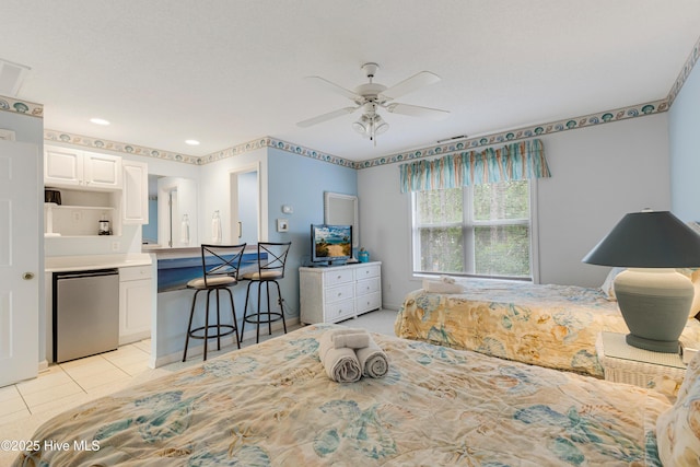 bedroom featuring ceiling fan, light tile patterned flooring, and fridge