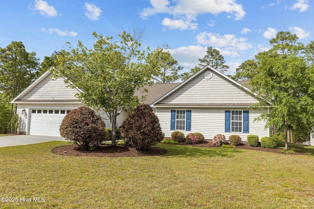 view of front of property with a front yard and a garage