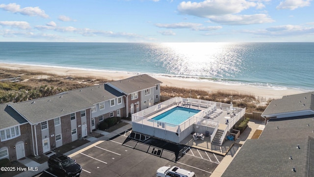 bird's eye view with a beach view and a water view