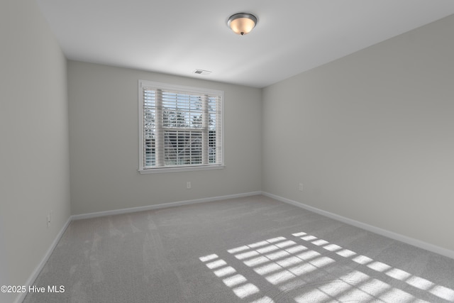 unfurnished room with light carpet