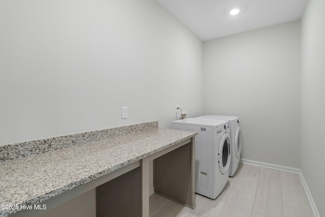 laundry room featuring washing machine and clothes dryer