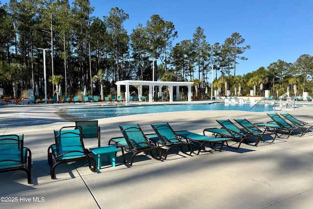 view of swimming pool with a pergola and a patio area