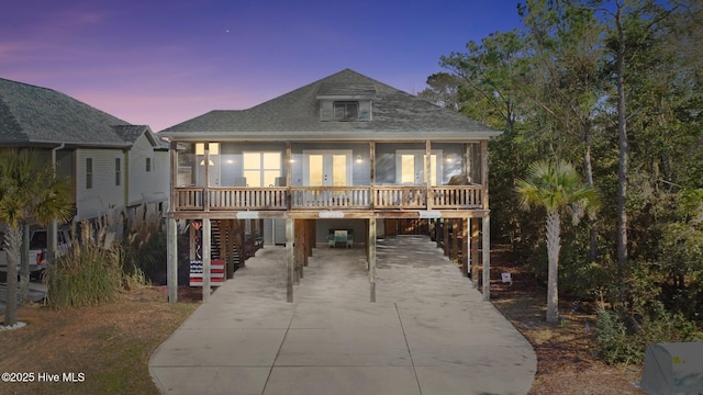 beach home featuring a carport