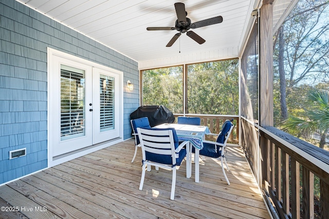 sunroom featuring french doors and ceiling fan