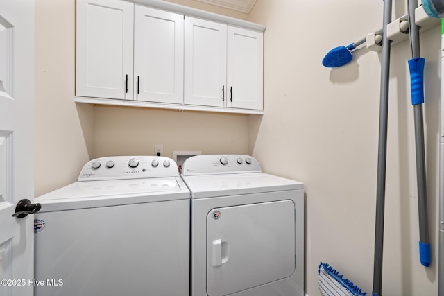 laundry area with cabinets and independent washer and dryer