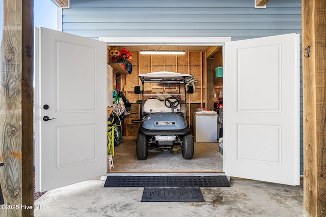 garage with wood walls